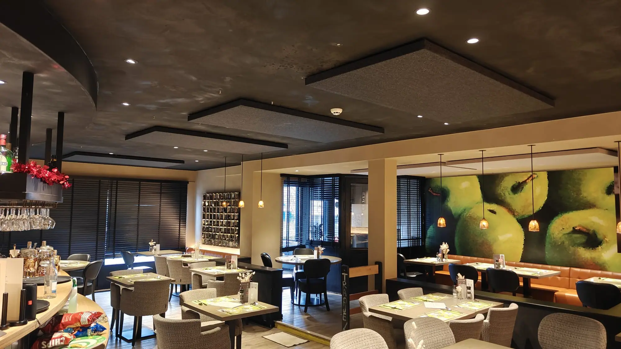 Restaurant with acoustic ceiling panels and an acoustic photo panel on the wall