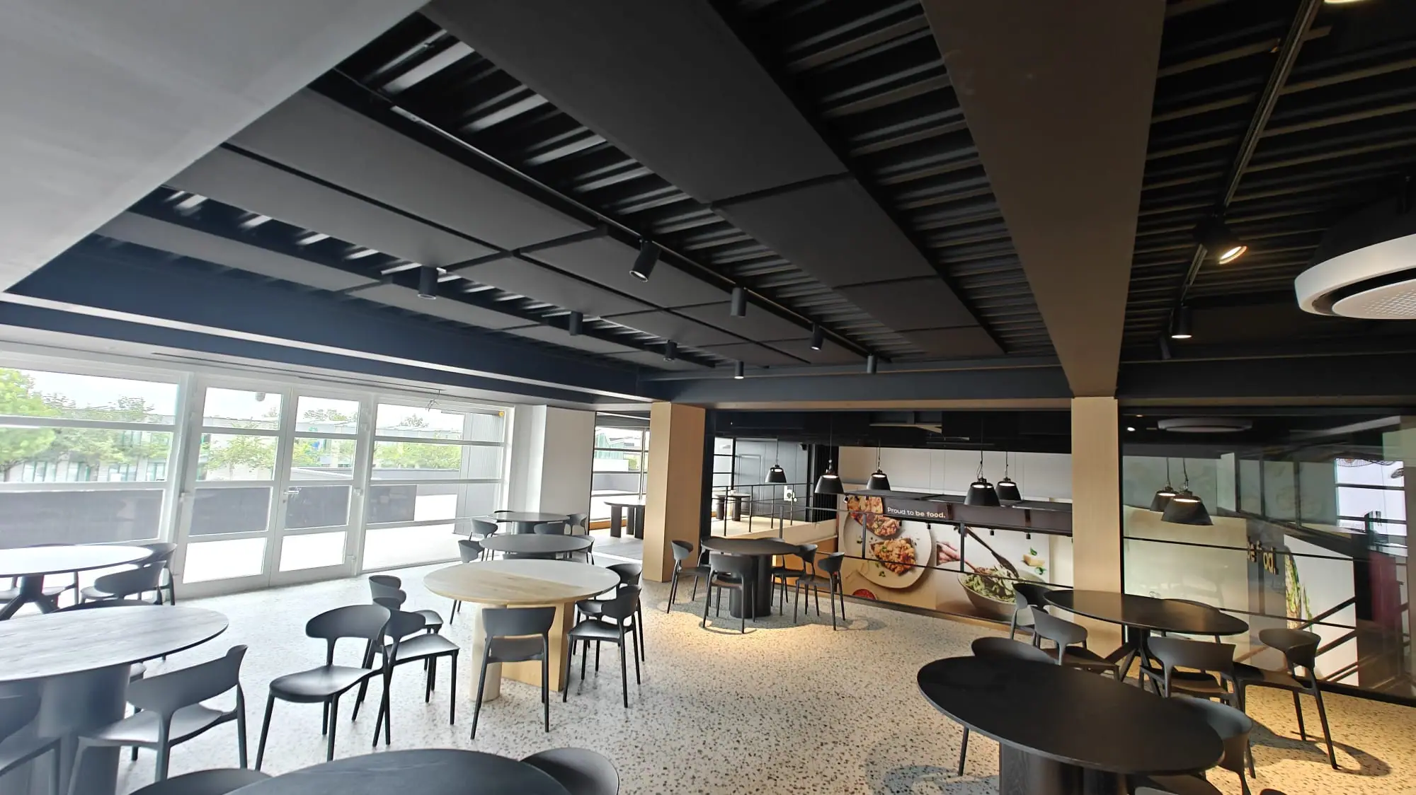 Staff restaurant with acoustic ceiling panels above the seating area